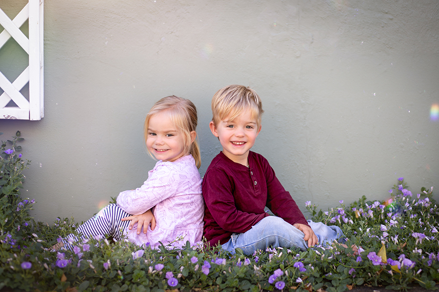 brother in  sister sitting back to back